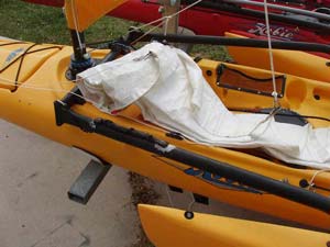 When I want to sail with the jib, I unroll the sheet lines and roll out the sail along the downwind side of the boat.