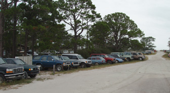 There were more cars on Dog Island -- junked out and rusting in the salt air -- than either people or buildings.