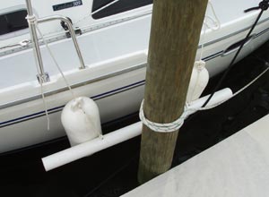 The completed fenderboards hanging on a Catalina 309 at the dock