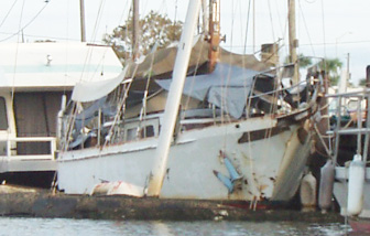 Sunken sailboat at the city marina